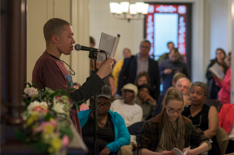 Writers Room participant Jordan McCullough reads to a crowd at last year's Writers Room anthology reading. Photo courtesy Jen Britton.
